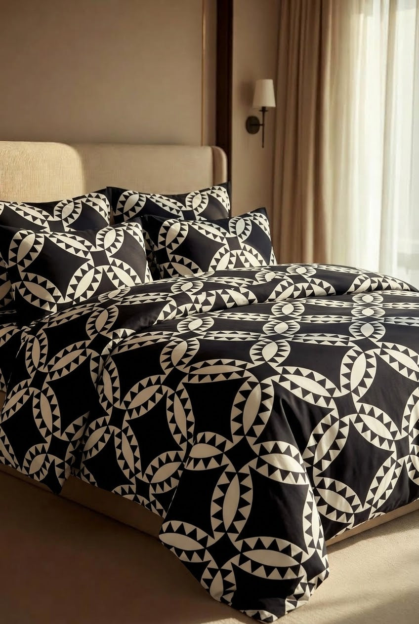 Marrakech Noir bedding close-up showing black and ivory interlocking ring pattern