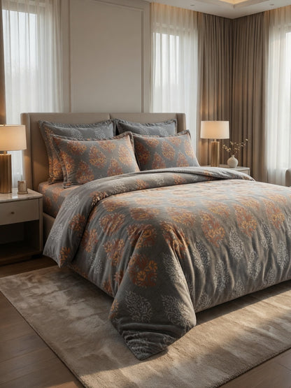 Bedroom with floral patterned bedding and matching pillows